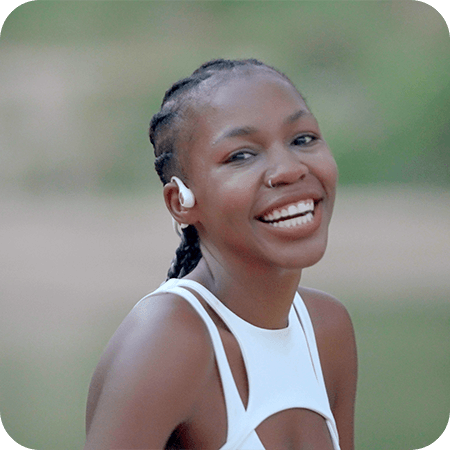 girl-smiles-with-run-air-open-ear-headphone