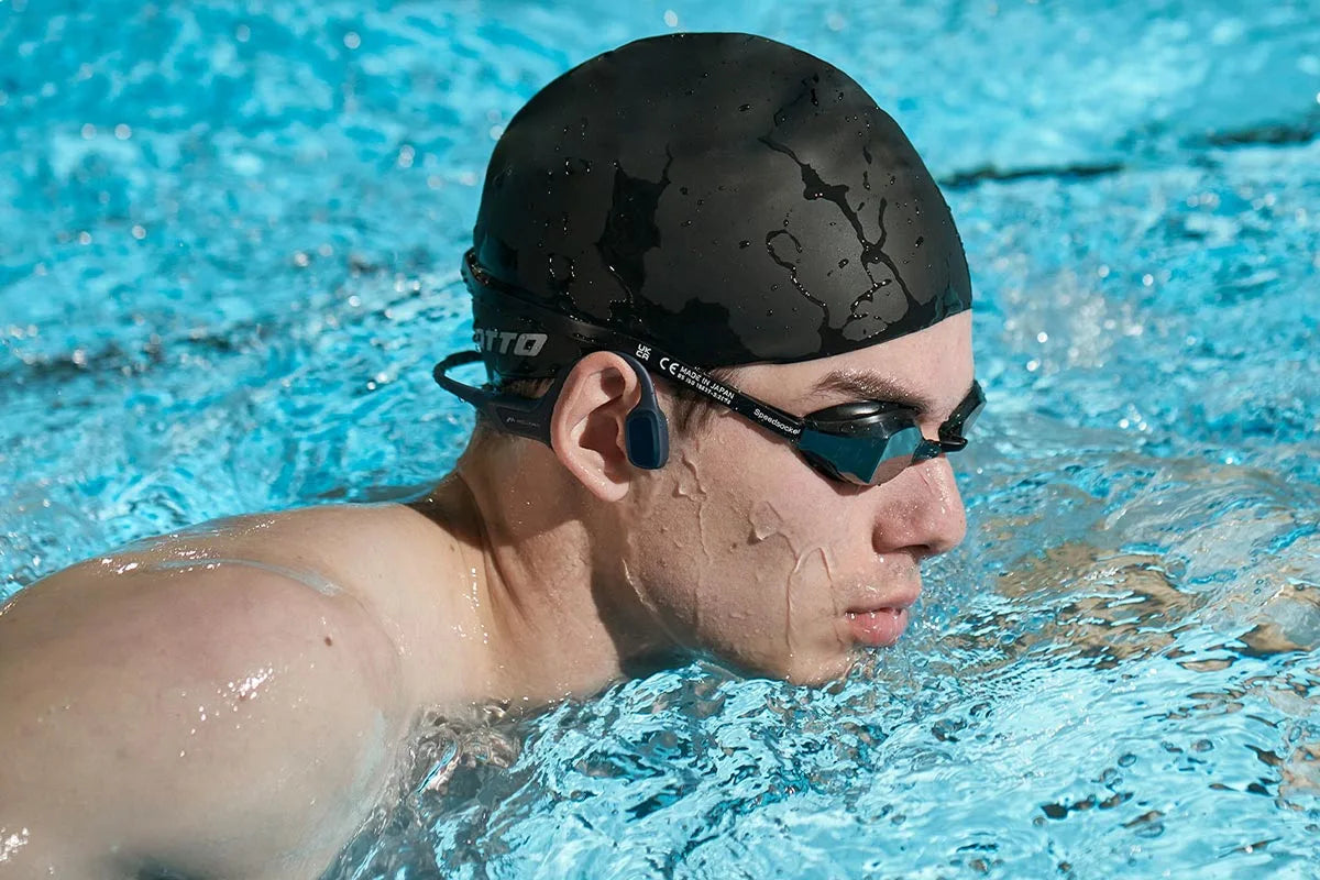 man-swims-with-HaptiFit-Terra-open-ear-headphone