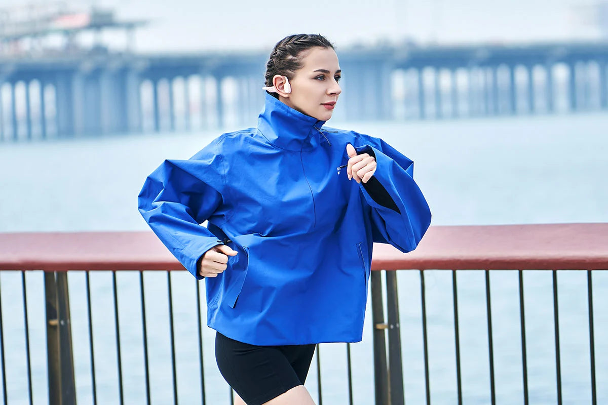 woman-runs-at-seaside-with-HaptiFit-Terra-open-ear-headphone